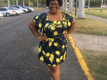Samantha in a blue dress with lemons